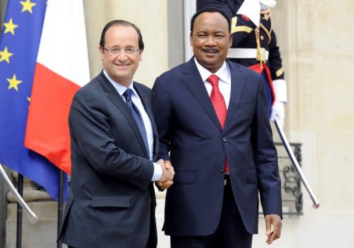 France's President Francois Hollande (left) welcomes Niger's President Mahamadou Issoufo before a meeting at the Elysee Palace in Paris on Sunday. There is a risk of "terrorist" groups setting up in the deserts of northern Mali, Hollande warned on Monday after talks with Issoufou