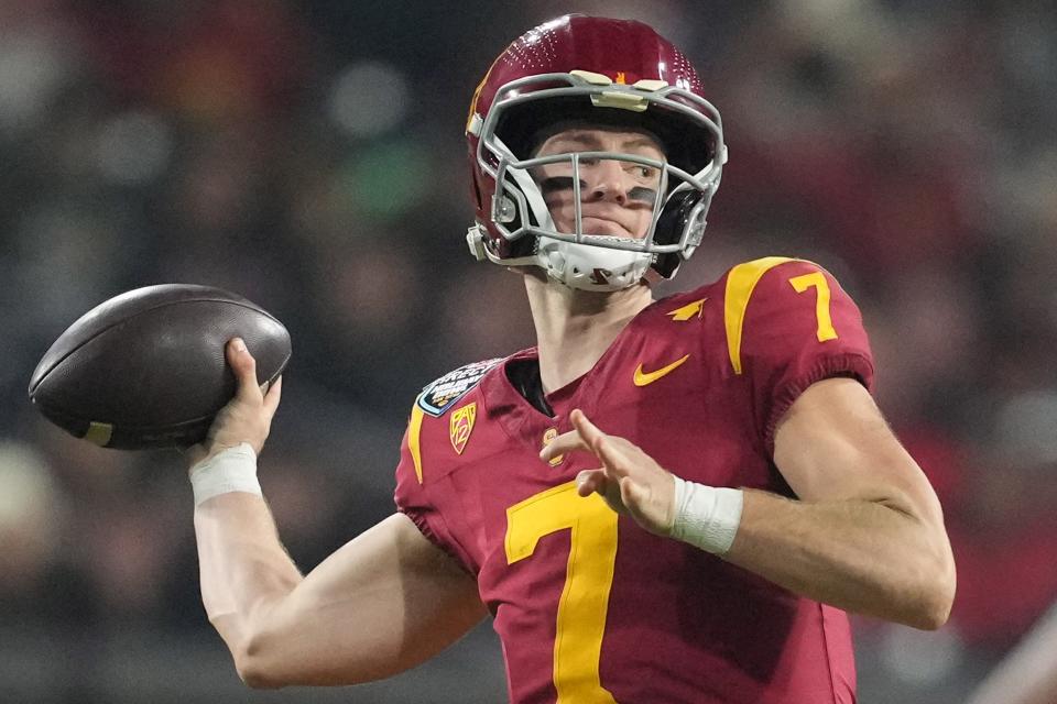 Dec 27, 2023; San Diego, CA, USA; Southern California Trojans quarterback Miller Moss (7) throws the ball against the Louisville Cardinalsin the first half of the Holiday Bowl at Petco Park. Mandatory Credit: Kirby Lee-USA TODAY Sports