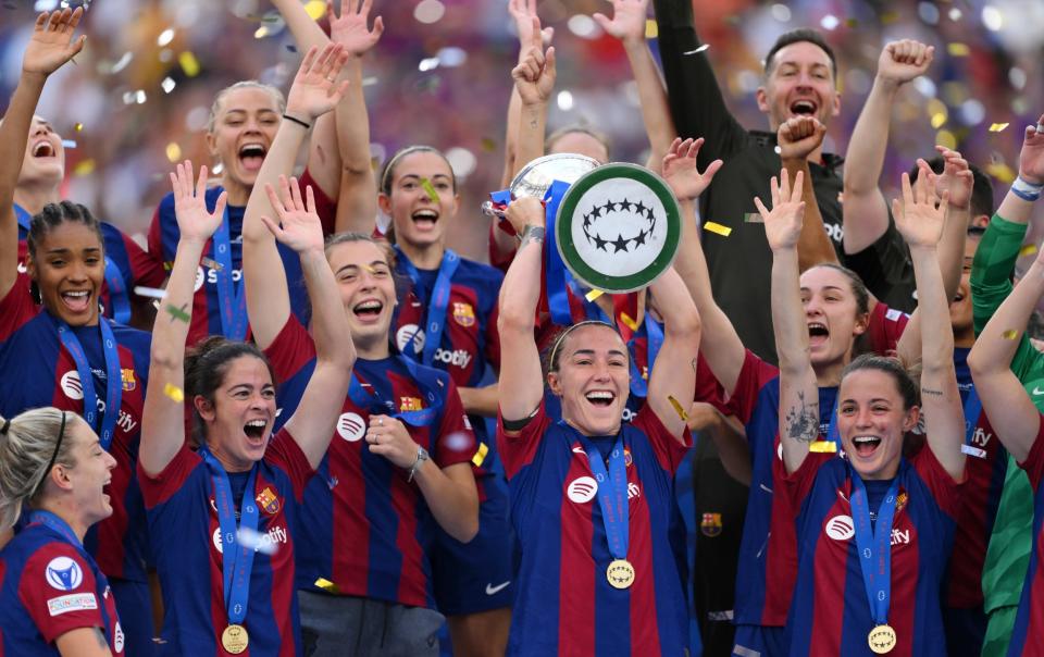 Lucy Bronze lifts the Women's Champions League Trophy