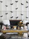 <p>If you're hosting a scary movie night, bring the on-screen horror to life with some scary decor. An on-theme bouquet surrounded by pumpkins and a skull decanter for the table and some flying <a href="https://www.marthastewart.com/852559/hanging-bats" rel="nofollow noopener" target="_blank" data-ylk="slk:paper bats;elm:context_link;itc:0;sec:content-canvas" class="link ">paper bats</a> for the walls will do. Floor cushions promise extra seating—power in numbers when it comes to scary movie marathons. Find out more from <a href="https://sugarandcharm.com/2016/09/charming-halloween-movie-night.html?section-23" rel="nofollow noopener" target="_blank" data-ylk="slk:Sugar and Charm;elm:context_link;itc:0;sec:content-canvas" class="link ">Sugar and Charm</a>. </p><p><a class="link " href="https://www.amazon.com/SunWorks-Construction-12-Inches-18-Inches-100-Count/dp/B002LARR9E/?tag=syn-yahoo-20&ascsubtag=%5Bartid%7C10057.g.2554%5Bsrc%7Cyahoo-us" rel="nofollow noopener" target="_blank" data-ylk="slk:BUY NOW;elm:context_link;itc:0;sec:content-canvas">BUY NOW</a> <strong><em>Black Construction Paper, $10</em></strong></p>