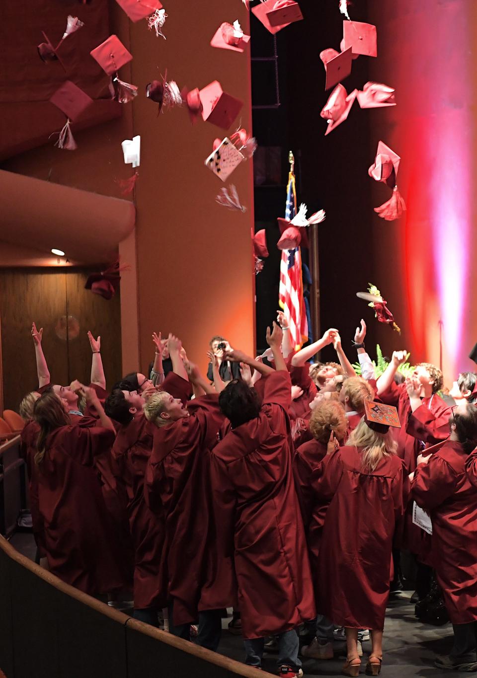 Barnsdall High School 2024 graduates throw their caps into the air during commencement on May 17, 2024 at the Bartlesville Community Center.