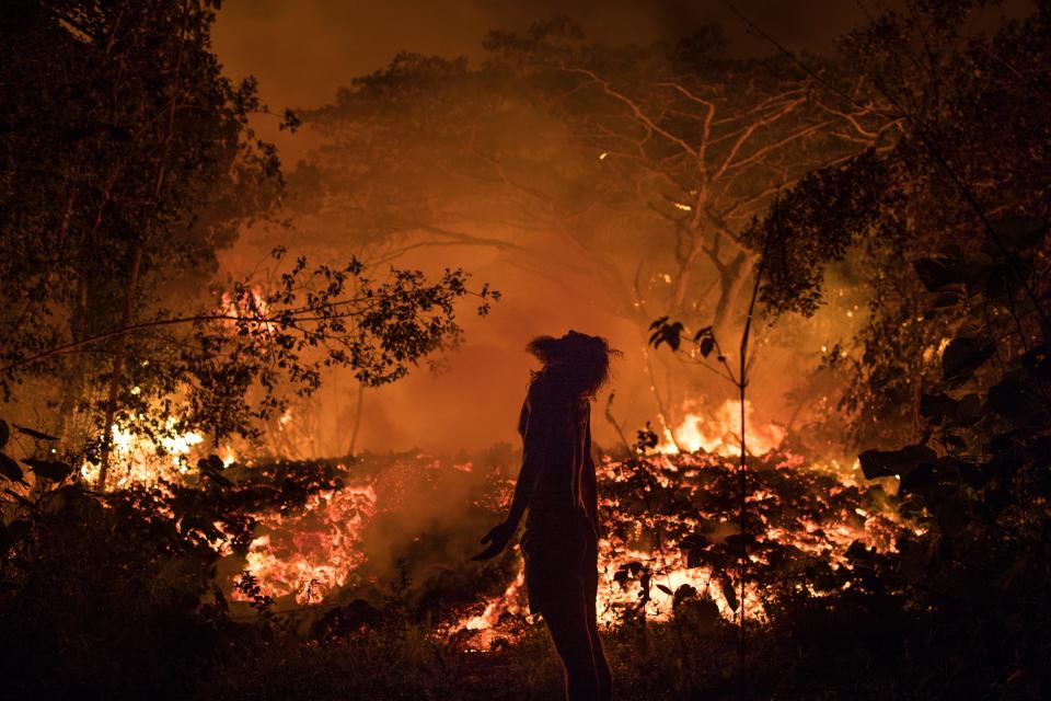 Richard Schott reacts to seeing lava from the Kilauea volcano up close as it flows through the Malama-Ki Forest Reserve and approaches Kapoho-Kalapana Rd. near Pahoa on Hawaii's Big Island on May 19, 2018.