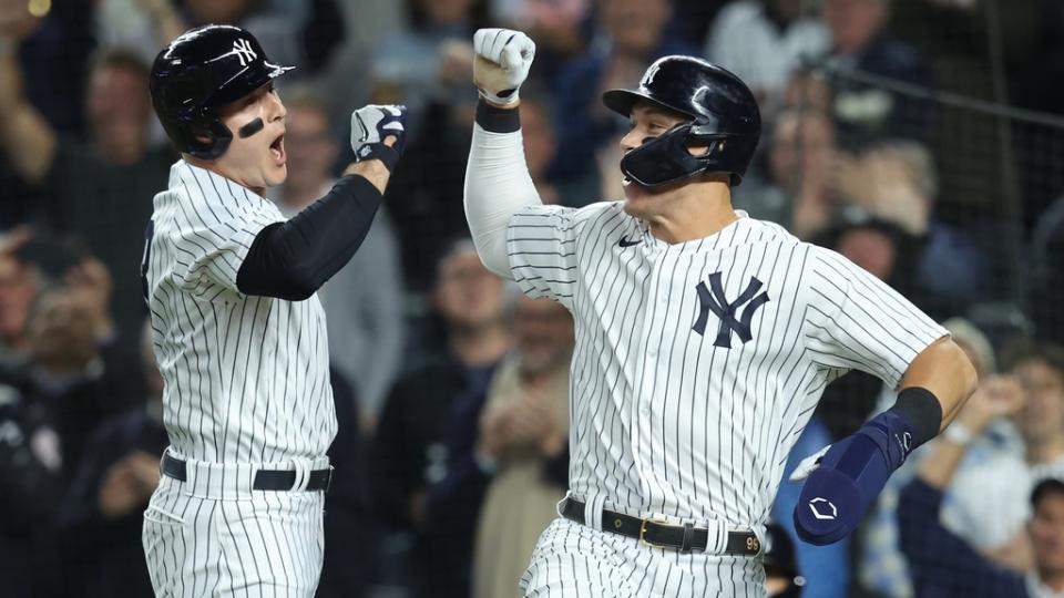 Oct 11, 2022;  Bronx, New York, USA;  New York Yankees first baseman Anthony Rizzo, left, and right fielder Aaron Judge celebrate after Rizzo hit a home run during the sixth inning against the Cleveland Guardians in game one of the ALDS for the 2022 MLB Playoffs at Yankee Stadium.