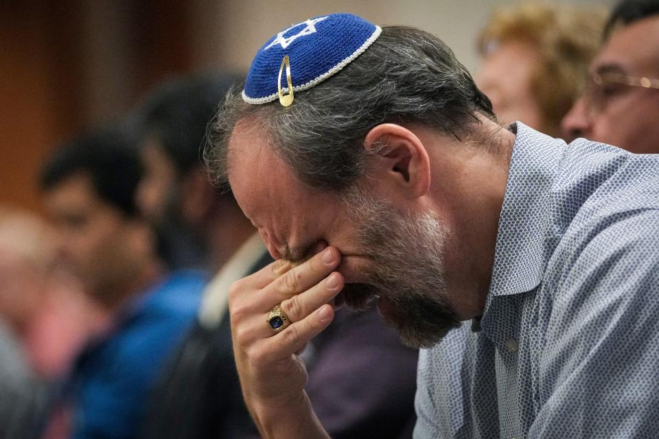 A man wipes away tears during an event organized to support Israel in its fighting with Hamas on Monday at Congregation Beth Yeshurun in Houston.