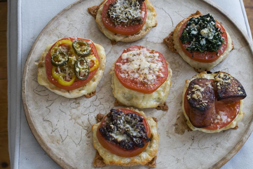 In this image taken on April 1, 2013, variations of an English muffin broiled cheese and tomato sandwich are shown in Concord, N.H. (AP Photo/Matthew Mead)