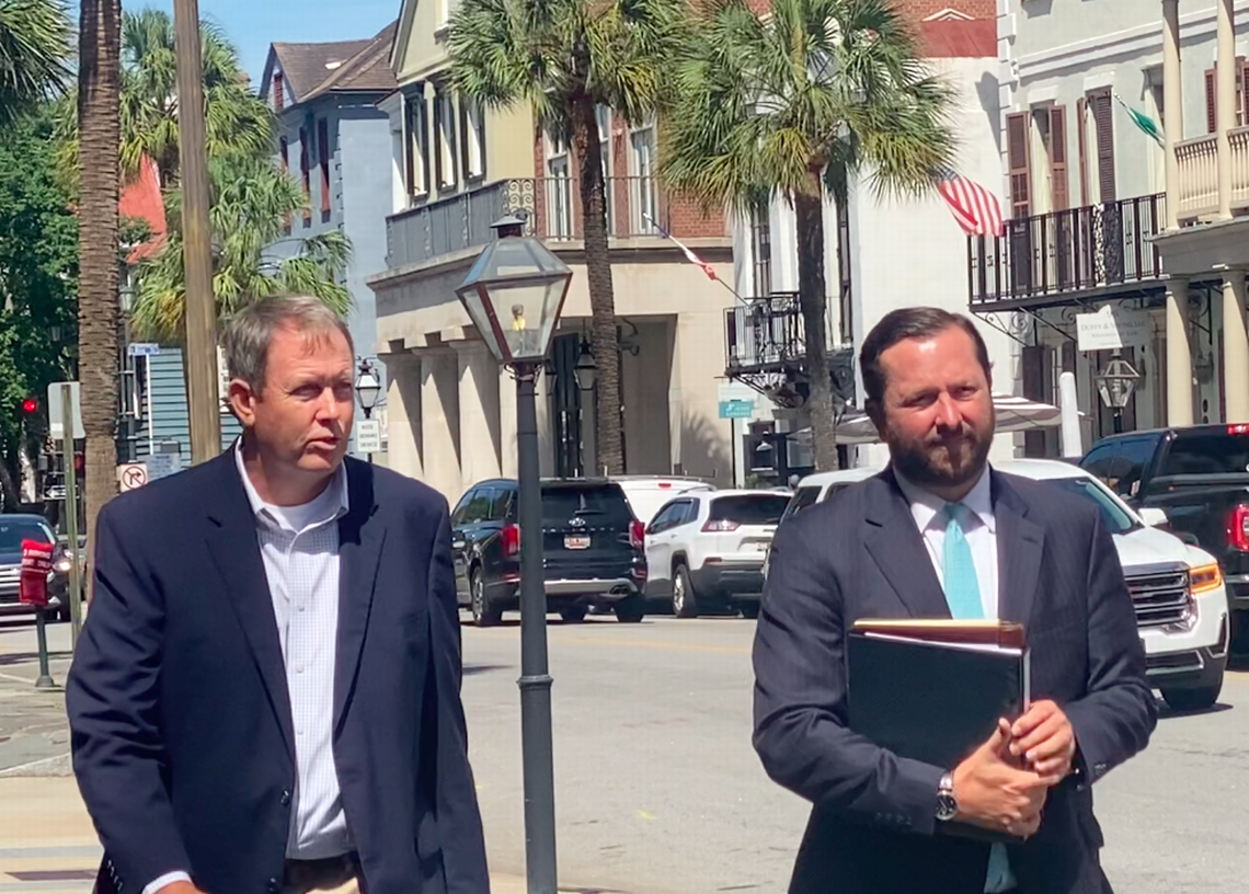 Former Hampton banker Russell Laffitte, left, leaves the federal courthouse in Charleston, S.C., on July 27, 2022, with his attorney Matt Austin.