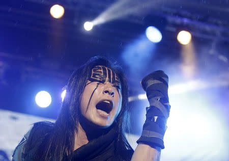 Freddy Lim, a candidate to the 2016 legislative election and singer of death metal band Chthonic, performs during a concert to boost his campaign in Taipei, Taiwan, December 26, 2015. REUTERS/Pichi Chuang