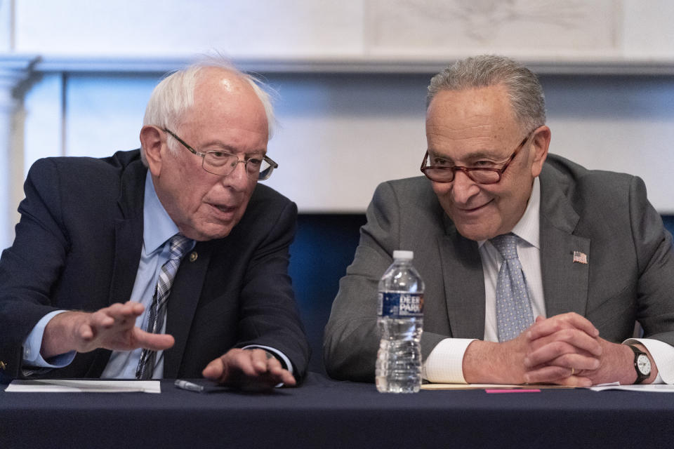 Senate Majority Leader Chuck Schumer of N.Y., right, sits next to Sen. Bernie Sanders, I-Vt., during a meeting with Senate Democrats on the Budget Committee, Wednesday, June 16, 2021, on Capitol Hill in Washington. (AP Photo/Jacquelyn Martin)