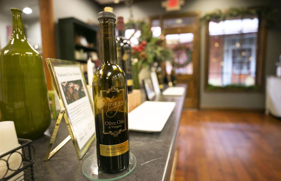 A bottle of dark balsamic vinegar at Outrageous Olive Oils & Vinegars in old town Scottsdale on Tuesday, December 11, 2018. The shop is owned by former child actor, Frankie Muniz and his fiance Paige Price.