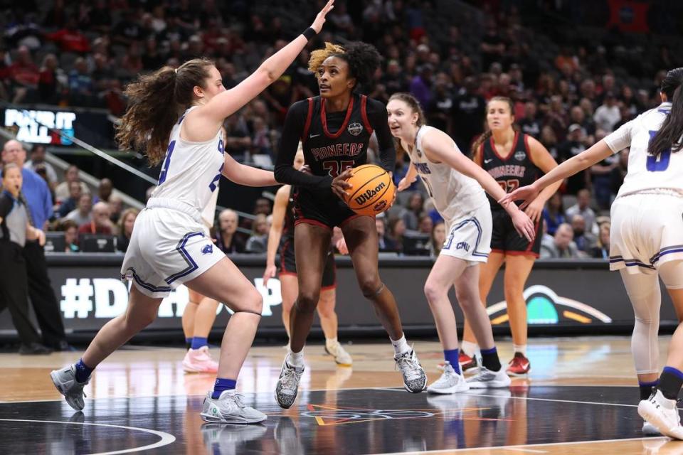 Transylvania senior forward Dasia Thornton gathers the ball before shooting during the NCAA Division III Tournament championship game Saturday. Thornton was the only player to record a double-double in the title game.