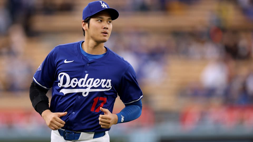Shohei Ohtani warms up before a preseason game against the Los Angeles Angels at Dodger Stadium on March 24, 2024. - Harry How/Getty Images