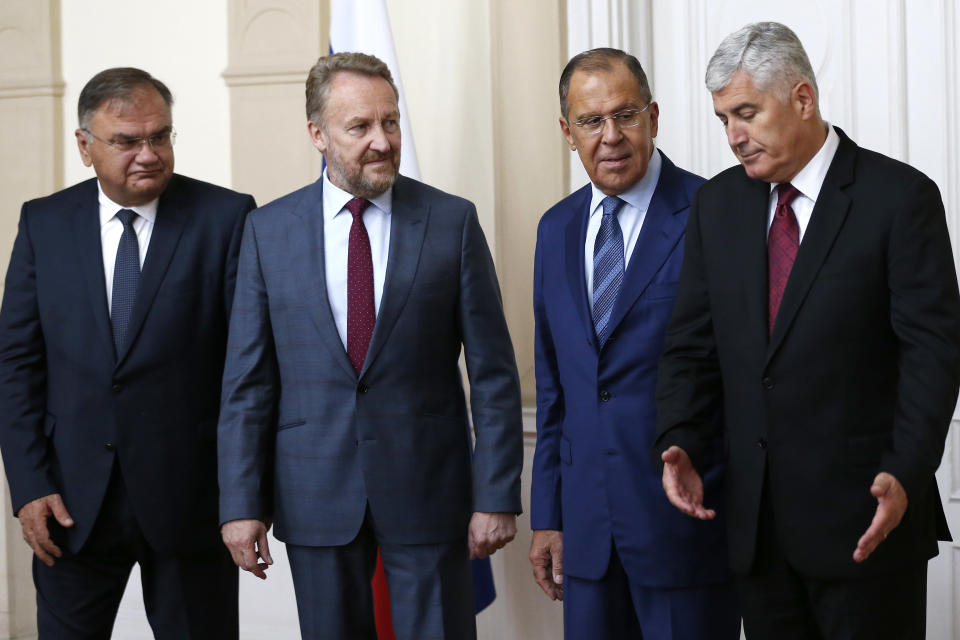 Russian Foreign Minister Sergey Lavrov, second from right, poses for a photo with members of the Bosnia’s three-member presidency Mladen Ivanic, left, Bakir Izetbegovic, second from left, and Dragan Covic, right, during their meeting in Sarajevo, Bosnia, Friday, Sept. 21, 2018. Russia’s foreign minister is visiting Bosnia, an ethnically-divided Balkan country where Moscow has maintained strong influence among the country’s Serbs. (AP Photo/Amel Emric)