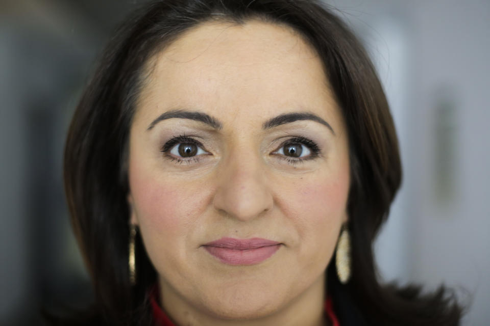 In this photo taken Monday, April 3, 2017 German lawmaker Sevim Dagdelen of the Left Party poses for a portrait prior to an interview with the Associated Press in Berlin, Germany. Dagdelen said she received death threats after speaking out publicly against Turkish President Erdogan. After Turkish newspapers published her picture and berated her as a traitor, people in Germany attacked or insulted her on the street, she said. (AP Photo/Markus Schreiber)