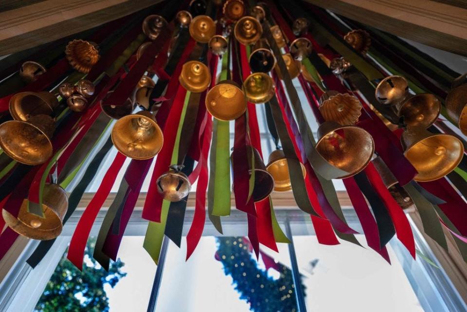 Trumpets and ribbons hang as part of the White House Christmas decorations in 2022