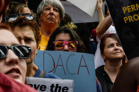 FILE PHOTO: People participate in a protest in defense of the Deferred Action for Childhood Arrivals program or DACA in New York, U.S., September 9, 2017. REUTERS/Stephanie Keith