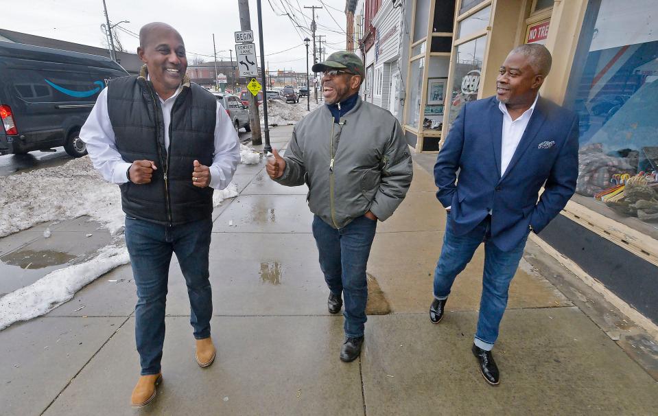 Leaders of the East Side Renaissance walk north along Parade Street in Erie on Feb. 17, 2022. From left to right are, Matthew Harris, 53, a former Pennsylvania State Trooper who created "Character Be About it," a crime-prevention program; Bishop Dwane Brock, 63, pastor of the Victory Christian Center and CEO of Eagle's Nest Leadership Corp.; and Marcus Atkinson, 52, the former executive director of the nonprofit ServErie who now teaches public speaking and enhanced reasoning to at-risk students.