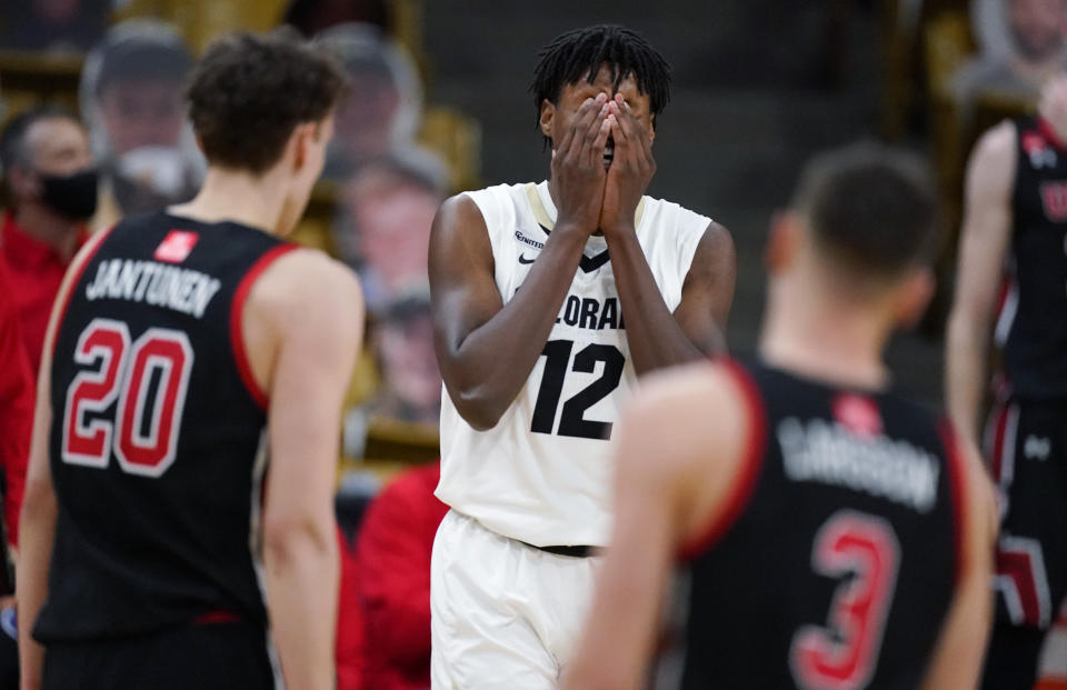 Colorado forward Jabari Walker, center, reacts after being called for a foul as Utah forward Mikael Jantunen, front left, and guard Pelle Larsson look on in the second half of an NCAA college basketball game Saturday, Jan. 30, 2021, in Boulder, Colo. Utah won 77-74. (AP Photo/David Zalubowski)