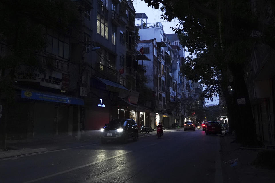 Road lights are seen switched off to save energy in Hanoi, Vietnam, on June 8, 2023. Vietnam has released a long-anticipated energy plan meant to take the country through the next decade and help meet soaring demand while reducing carbon emissions. (AP Photo/Hau Dinh)