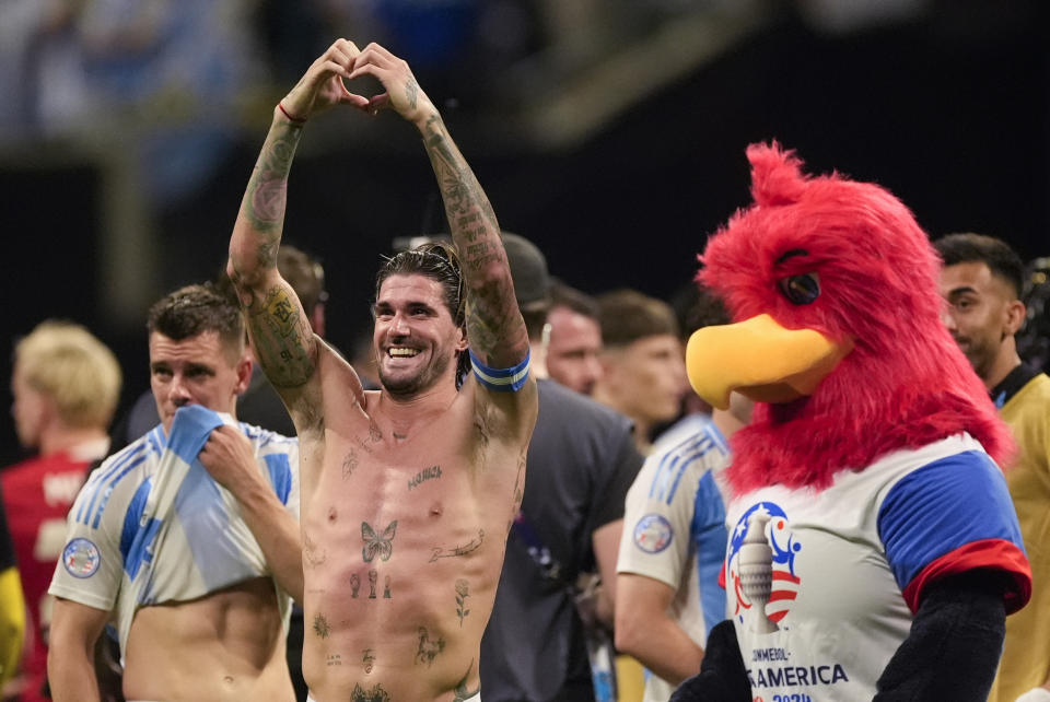 Argentina's Rodrigo De Paul smiles after his side's 2-0 victory over Canada in a Copa America Group A soccer match in Atlanta, Thursday, June 20, 2024. (AP Photo/Mike Stewart)