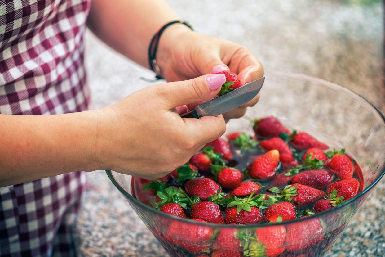 cutting and soaking strawberries