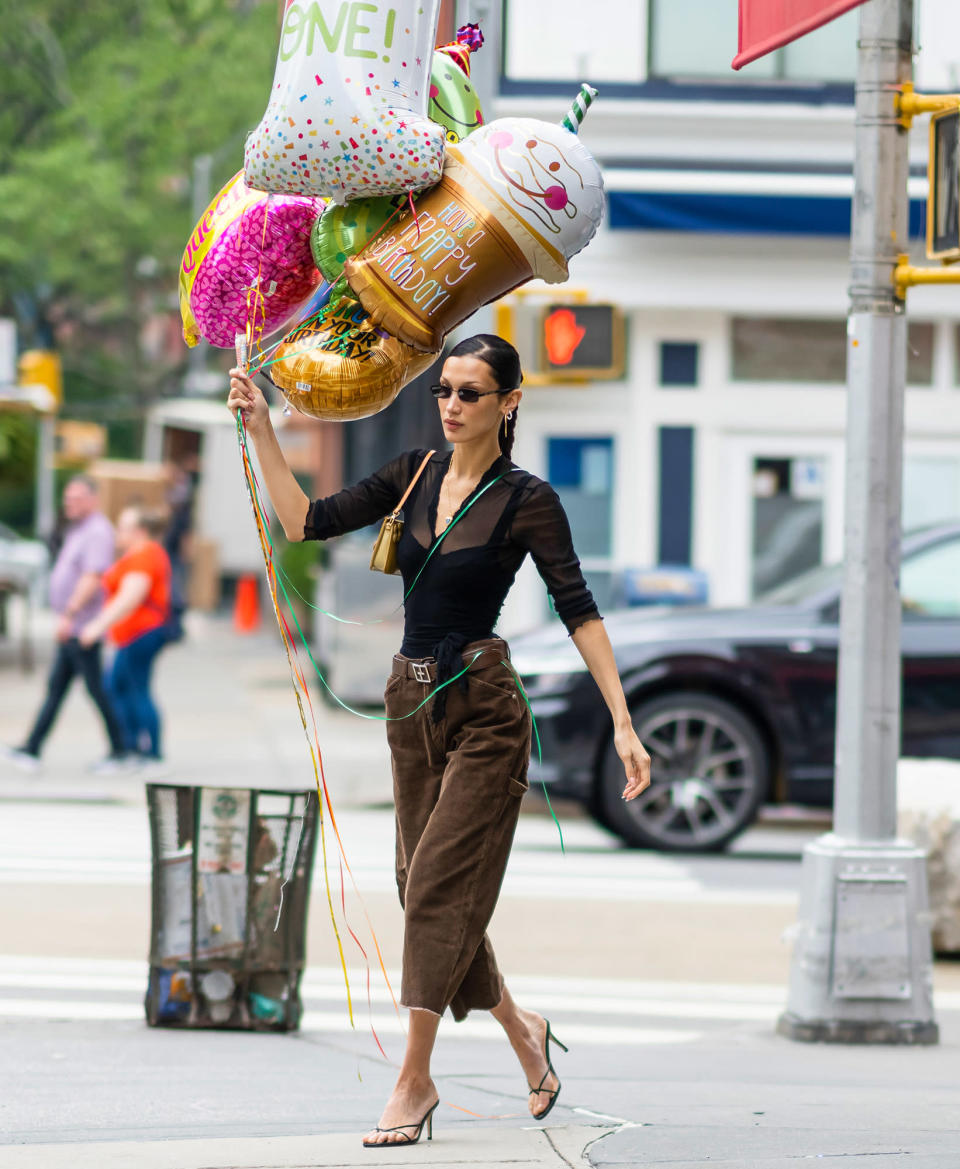 <p>On May 20, Bella Hadid picks up a fun bouquet of balloons while out in N.Y.C.</p>