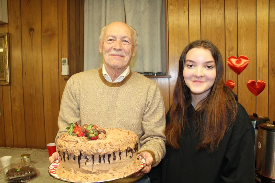Fred DiPasquale, of Meyersdale, paid $105 for Tarrah Cox's Strawberry Chocolate Delight cake entered into the Death By Chocolate competition. This was the first year that Cox, 12, entered the competition and while she didn't win with her cake, her candy called Strawberry Cheesecake Bites won second.