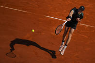 Jannik Sinner, of Italy, returns the ball to Stefanos Tsitsipas, of Greece, during their Monte Carlo Tennis Masters semifinal match in Monaco, Saturday, April 13, 2024. (AP Photo/Daniel Cole)