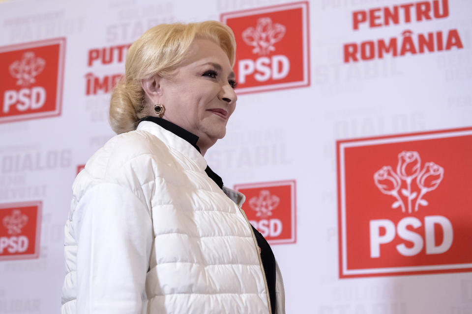 Former Romanian Prime Minister Viorica Dancila smiles during a statement after exit polls indicate her as the runner up of the presidential race, with up to 25 percent of the votes in Bucharest, Romania, Sunday, Nov. 10, 2019. Dancila will face incumbent President Klaus Iohannis in an election runoff on Nov. 24. (AP Photo/Alexandru Dobre)