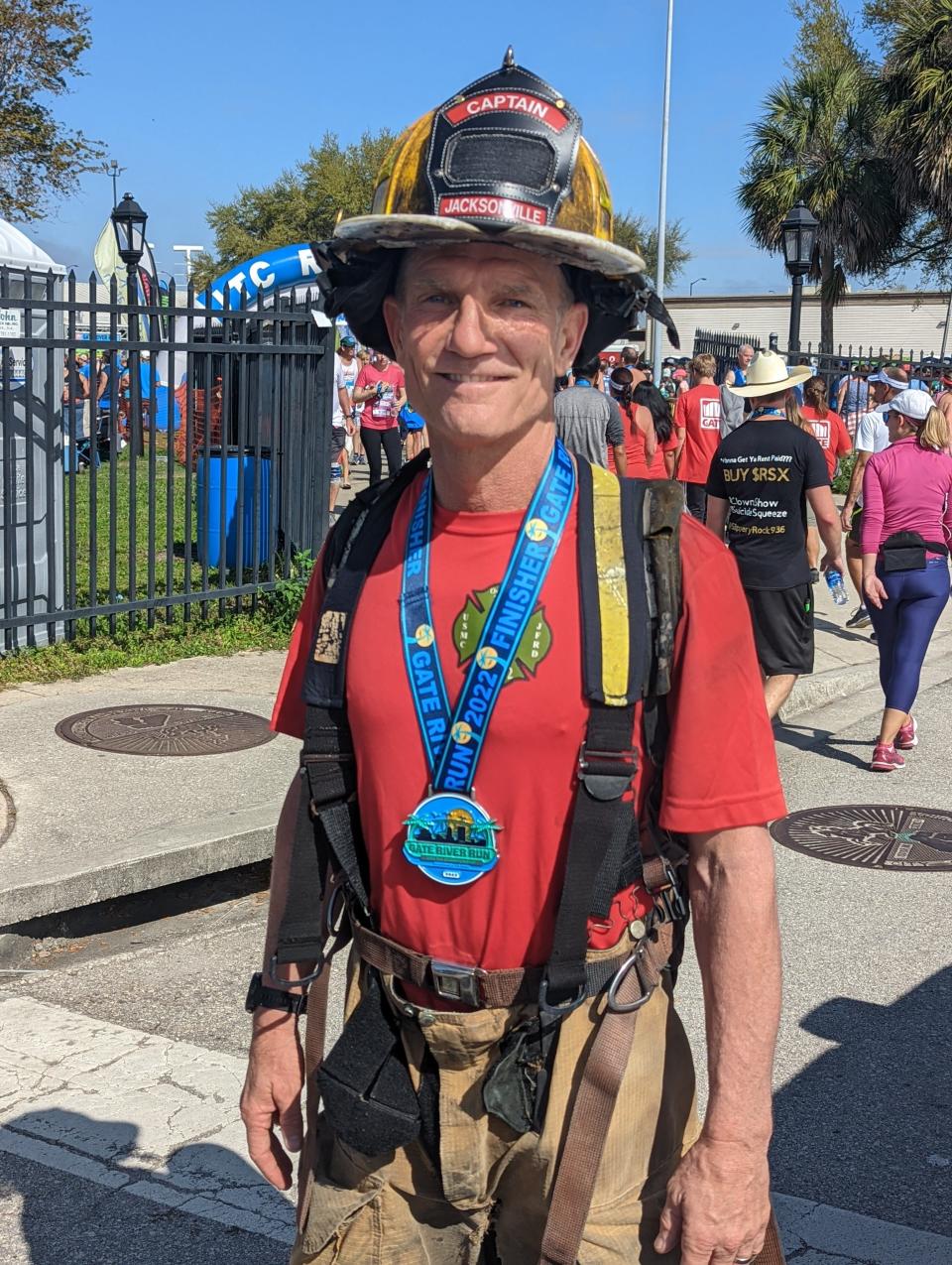 Capt. Eric Prosswimmer of the Jacksonville Fire and Rescue Department completed the Gate River Run in full firefighting gear on March 5, 2022. [Clayton Freeman/Florida Times-Union]