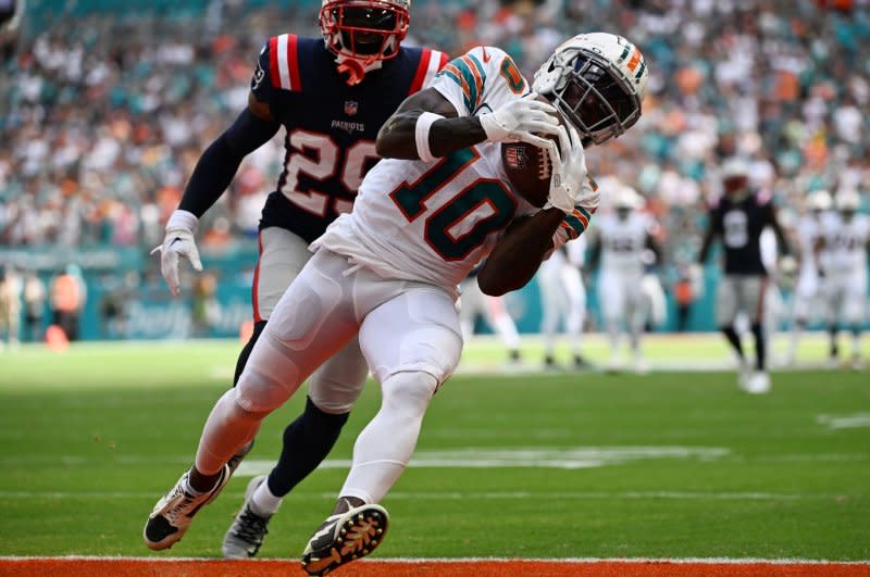 Miami Dolphins wide receiver Tyreek Hill (R) scores a touchdown against the New England Patriots on Sunday in Miami Gardens, Fla. Photo by Larry Marano/UPI