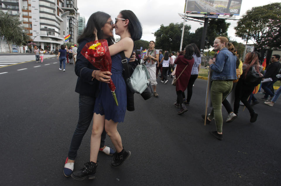 A couple kisses during the Gay Pride Parade in Quito, Ecuador, Saturday, June 29, 2019. (AP Photo/Dolores Ochoa)