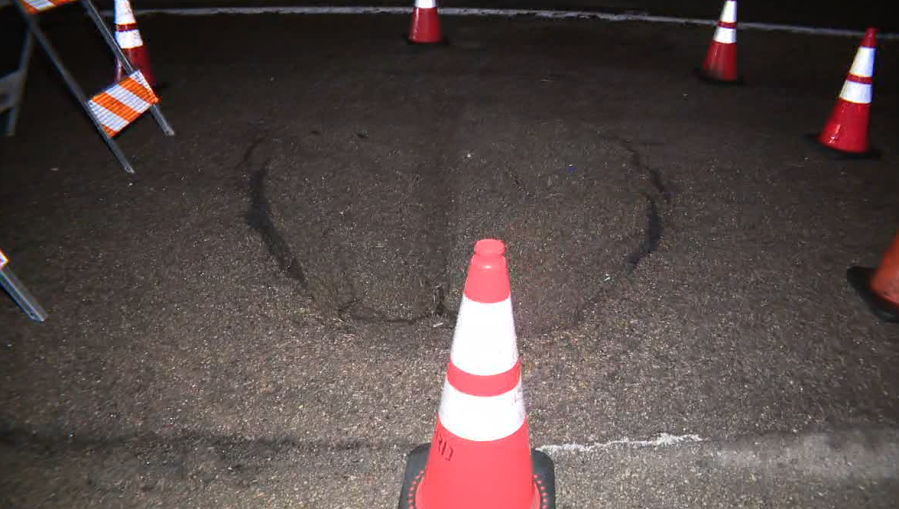 A sinkhole opened near the westbound State Route 54 interconnector with Interstate 805 on April 15, 2024. (FOX 5/KUSI)