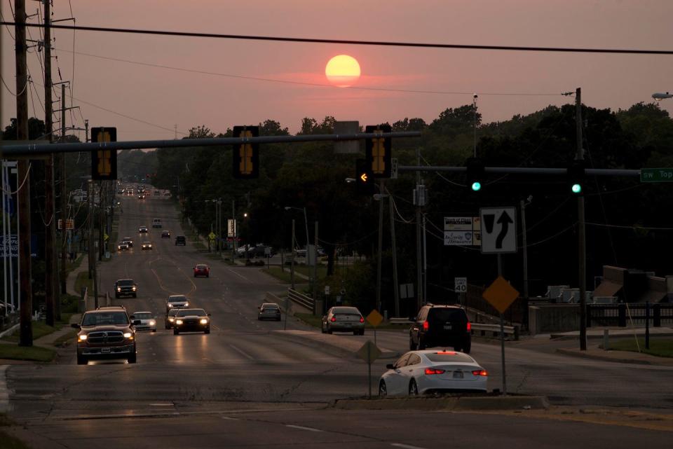 High heat and humidity are expected Tuesday and Wednesday in Topeka, where this photo was taken showing the sun setting over the intersection at S.W. 21st and Topeka Boulevard.