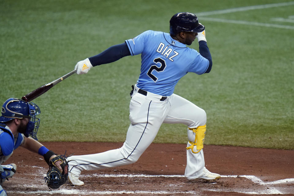 Tampa Bay Rays' Yandy Diaz lines an RBI single off Kansas City Royals starting pitcher Brad Keller during the third inning of a baseball game Tuesday, May 25, 2021, in St. Petersburg, Fla. Rays' Brett Phillips scored. (AP Photo/Chris O'Meara)