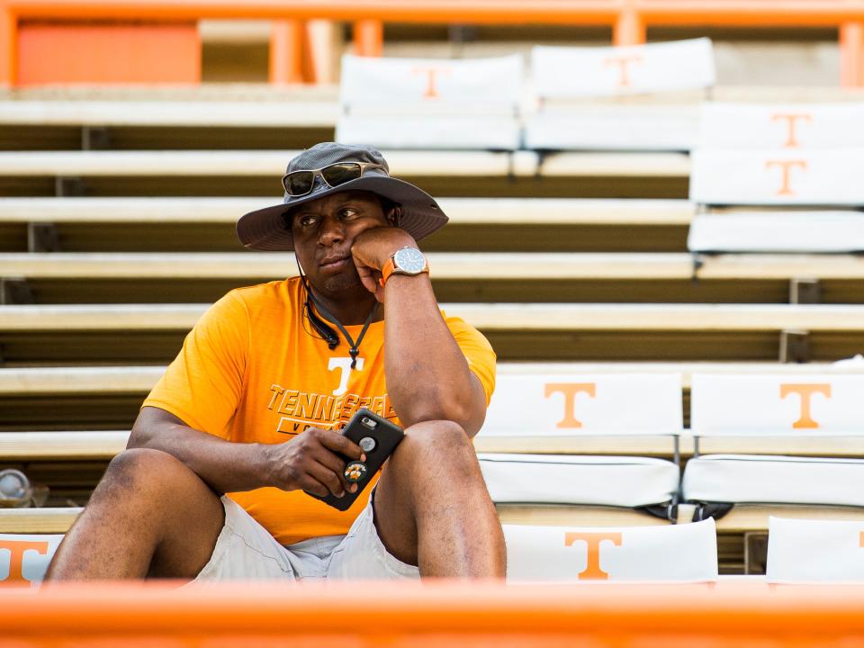 A dejected Tennessee fan looks away as Georgia State storms the field in celebration Aug. 31, 2019.