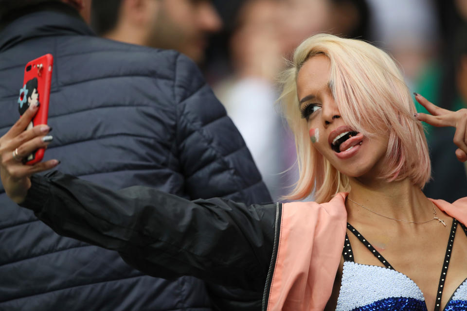 <p>A female fan of Russia takes a selfie during the 2018 FIFA World Cup Russia group A match between Russia and Saudi Arabia at Luzhniki Stadium on June 14, 2018 in Moscow, Russia. (Photo by Matthew Ashton – AMA/Getty Images) </p>