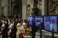 Cardinals who could not preside due to COVID-19 attends via video connection a consistory ceremony where 13 bishops were elevated to a cardinal's rank in St. Peter’s Basilica at the Vatican, Saturday, Nov. 28, 2020. (Fabio Frustaci/POOL via AP)