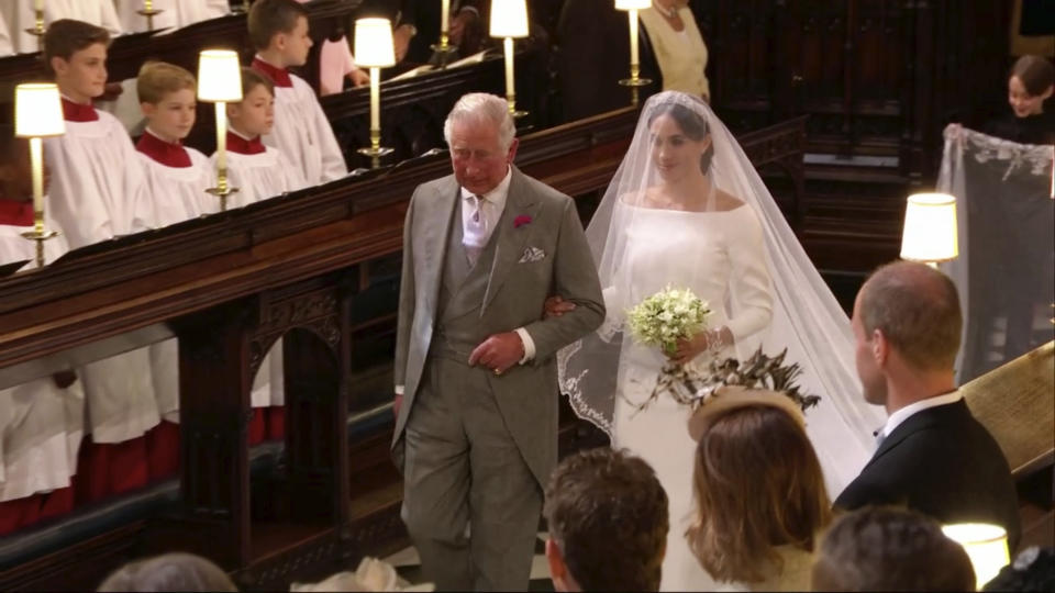 Meghan Markle walks down the aisle with Prince Charles for her wedding ceremony at St. George's Chapel in Windsor Castle in Windsor on May 19. (Photo: ASSOCIATED PRESS)