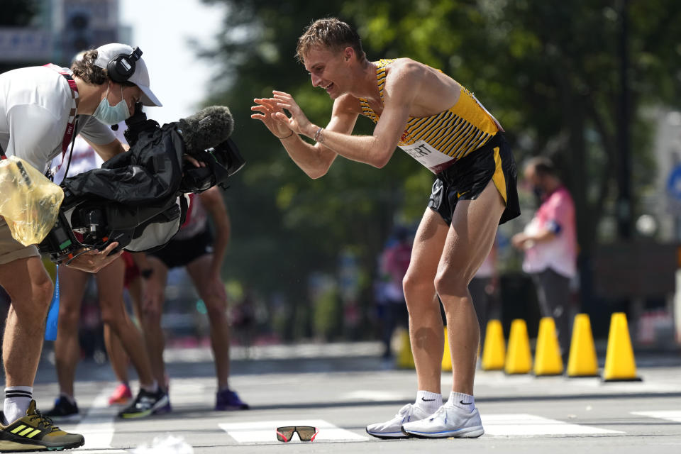 Jonathan Hilbert, of Germany, celebrates after crossing the finish line second in the men's 50km race walk at the 2020 Summer Olympics, Friday, Aug. 6, 2021, in Sapporo, Japan. (AP Photo/Shuji Kajiyama)