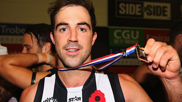 Collingwood star Steele Sidebottom with the Anzac Day Medal.
