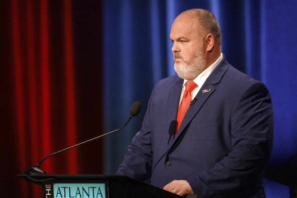 Philip Singleton listens at the Congressional District 3 (Republican) Debate during the Atlanta Press Club Loudermilk-Young Debate Series on Sunday, April 28, 2024, in Atlanta. (AP Photo/Jason Allen)