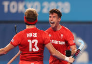 <p>TOKYO, JAPAN - AUGUST 01: Samuel Ian Ward of Team Great Britain celebrates with teammate Phillip Roper after scoring their team's first goal during the Men's Quarterfinal match between India and Great Britain on day nine of the Tokyo 2020 Olympic Games at Oi Hockey Stadium on August 01, 2021 in Tokyo, Japan. (Photo by Naomi Baker/Getty Images)</p> 