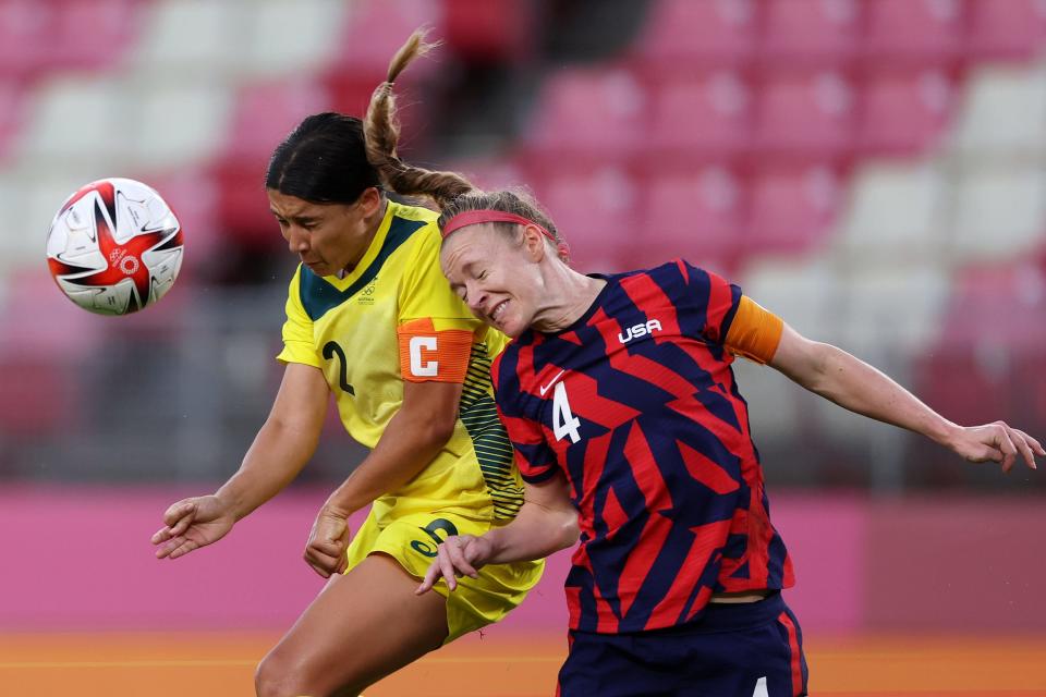 Australia's Sam Kerr rises up for a header against USWNT captain Becky Sauerbrunn.