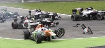 Force India Formula One driver Paul di Resta of Britain loses his front wheel after a collision with Lotus F1 Formula One driver Romain Grosjean (not pictured) of France at the start of the Italian F1 Grand Prix at the Monza circuit September 8, 2013. Resta retired from the race after the incident. REUTERS/Enrico Schiavi (ITALY - Tags: SPORT MOTORSPORT F1 TPX IMAGES OF THE DAY)