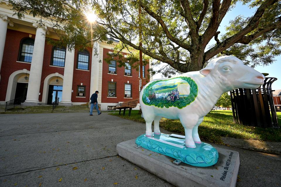 Webster Town Hall's Slater's Sheep, sponsored by Jeffco Fibres at the Webster Town Hall. The piece, called shepherds by day and by night, was created by artist Maria Palkon.