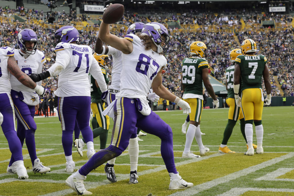 Minnesota Vikings tight end T.J. Hockenson (87) celebrates after catching a 2-yard touchdown pass during the second half of an NFL football game against the Green Bay Packers, Sunday, Oct. 29, 2023, in Green Bay, Wis. (AP Photo/Mike Roemer)