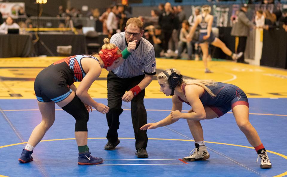 Tecumseh-Shawnee Heights' Reece Taylor prepares to wrestle Topeka-Seaman's Madison Murray at 6-5A girls state wrestling on Thursday.