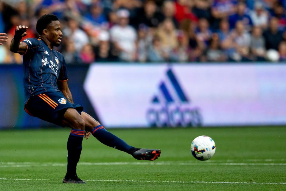 FC Cincinnati forward Dominique Badji (14) passes in the first half of the MLS match between FC Cincinnati and New England Revolution at TQL Stadium in Cincinnati on Saturday, May 21, 2022. 