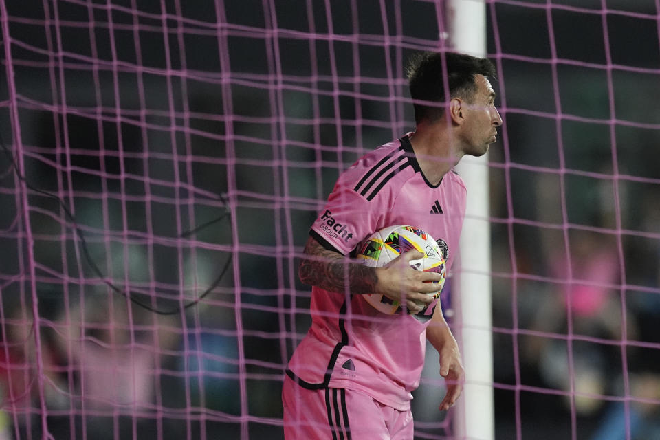 Inter Miami forward Lionel Messi recovers the ball from the St. Louis City goal after Inter Miami forward Luis Suarez (9) scored a goal during the first half of an MLS soccer match Saturday, June 1, 2024, in Fort Lauderdale, Fla. (AP Photo/Rebecca Blackwell)