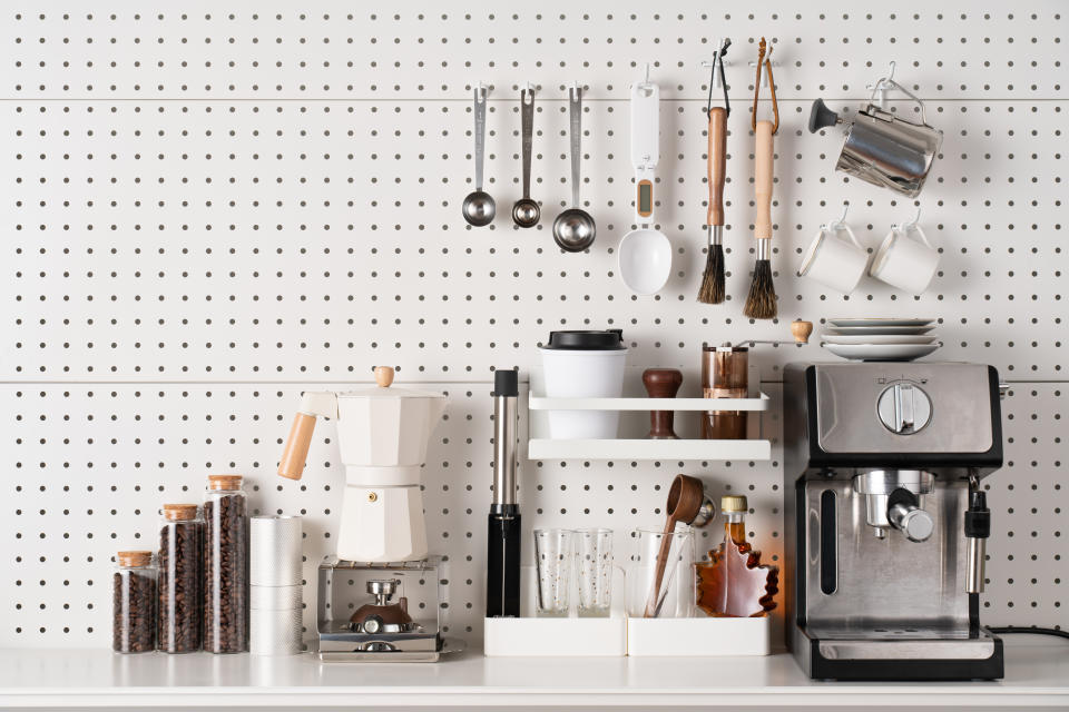 Espresso Coffee Maker and Accessories Knolling on White Colored Pegboard Background.